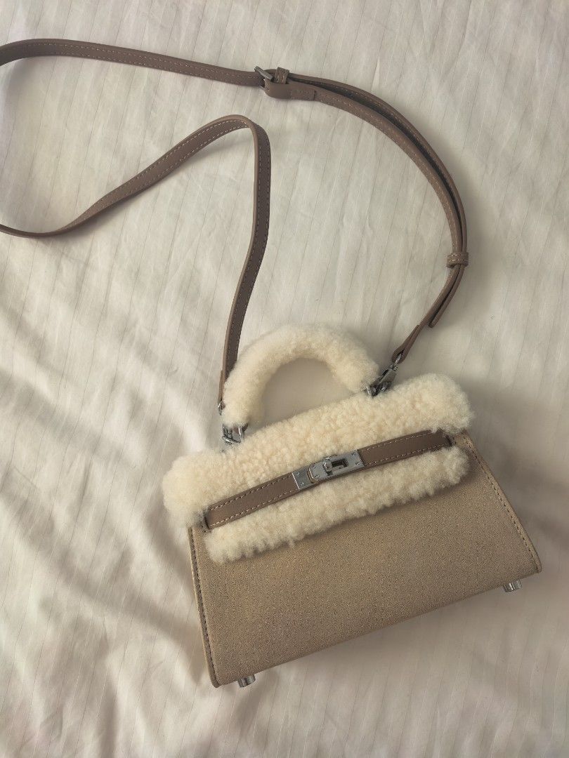 Mini Kelly by UGG Authentic (Category: Luxury Bags & Wallets) located in Quezon City. Submitted by quiltz (Listing ID 1460980780, Image 1). Description: UGG Australia Authentic Over Shoulder Bag Two Colors Available Sand (lighter) Chestnut (darker, tan) Fluffy Wool Top Beautiful thick Ugg Leather Mini Kelly look Hermes Not chanel gucci lv fendi flap classic tote prada miu designer ysl cd dior vuitton fashion statement Meet Up West Ave QC Makati.