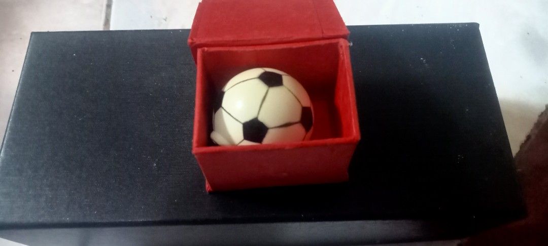 Mini Soccer Ball Charm in Red Box (Category: Other Stationery & Craft) located in Paranaque City. Submitted by dimaguilaa94969 (Listing ID 1460960320, Image 1). Description: - Adorable soccer ball charm for cabinet - Comes in a small red box - Features the classic black and white soccer ball pattern - Perfect for collectors - Makes a great small gift for any soccer enthusiast.