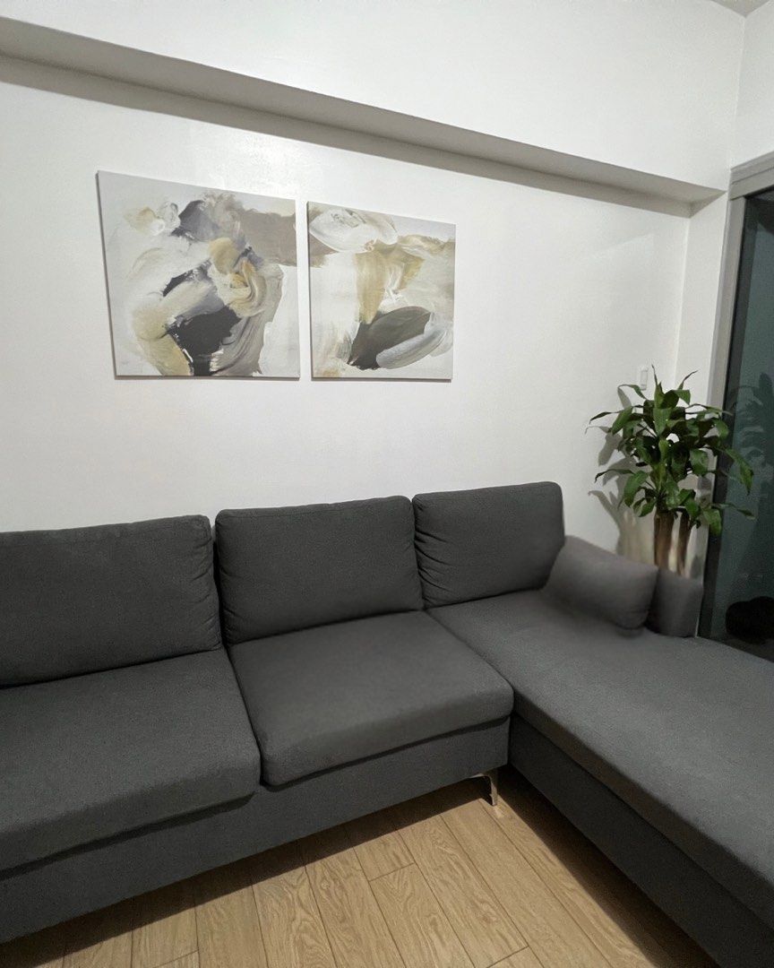 Minimalist L-Shape Sofa (Category: Sofas) located in Mandaluyong City. Submitted by elena_kk (Listing ID 1461096911, Image 1). Description: - Minimalist L-shape sofa - Dark gray fabric upholstery Rush sale ‼️ Moving out 🚚 - Modern and versatile design - Comfortable seating for multiple people - Easy to clean, removable seats and pillow cases - Available for meetup at Eastwood .