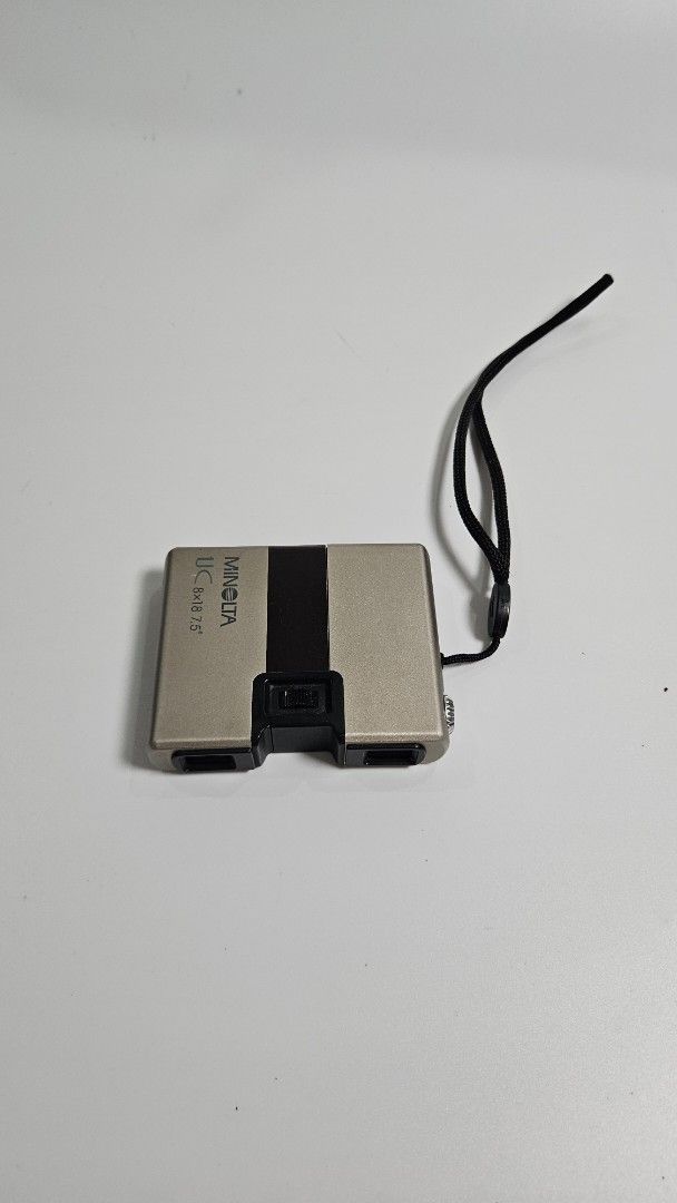 Minolta UC 8x18 7.5° Compact Binoculars (Category: Lens & Kits) located in Alfonso. Submitted by jbcamet (Listing ID 1461040748, Image 1). Description: - Minolta UC Binoculars - Magnification: 8x18 - Field of View: 7.5 degrees - Compact and lightweight design - Includes wrist strap - Ideal for travel and outdoor activities - Please check photos for item condition.