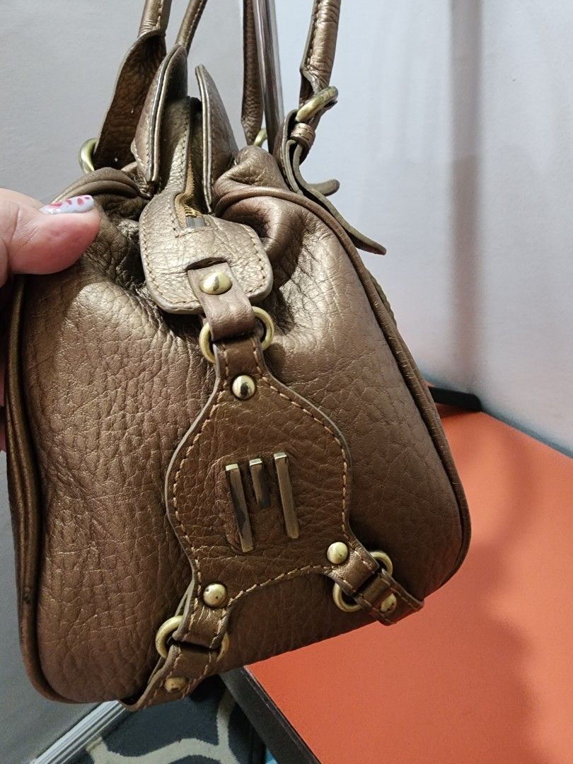 Missoni Metallic Bronze Leather Shoulder Bag (Category: Luxury Bags & Wallets) located in Manila. Submitted by babygirl.luxxe (Listing ID 1461061700, Image 3). Description: - Metallic bronze textured leather shoulder bag - Gold-tone hardware - Multiple interior compartments and zip pockets - Missoni logo printed lining - Ideal everyday bag with a stylish shine.