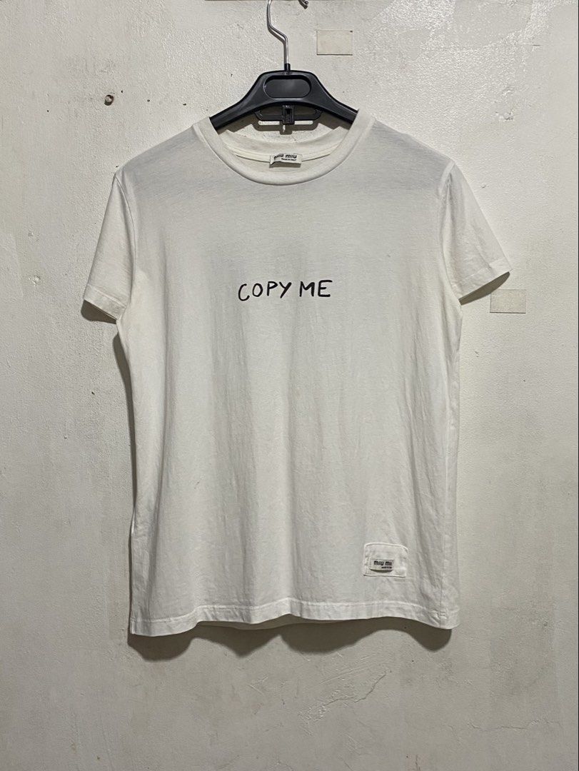 MIU MIU COPY ME TOPS (Category: Others Tops) located in Caloocan City. Submitted by alexahvaldez (Listing ID 1461081053, Image 2). Description: NEGO FOR SURE BUYER 18 / 23 EXCELLENT CONDITION NO ISSUE NEED WASH.