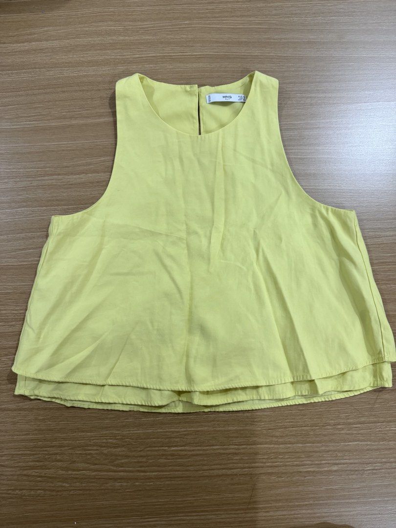 MNG Yellow Sleeveless Layered Top (Category: Sleeveless) located in Marikina City. Submitted by velune (Listing ID 1461009658, Image 1). Description: - Yellow MNG sleeveless top - Size XS - Layered hem detail - Button closure at the back with a keyhole opening - With matching shorts.