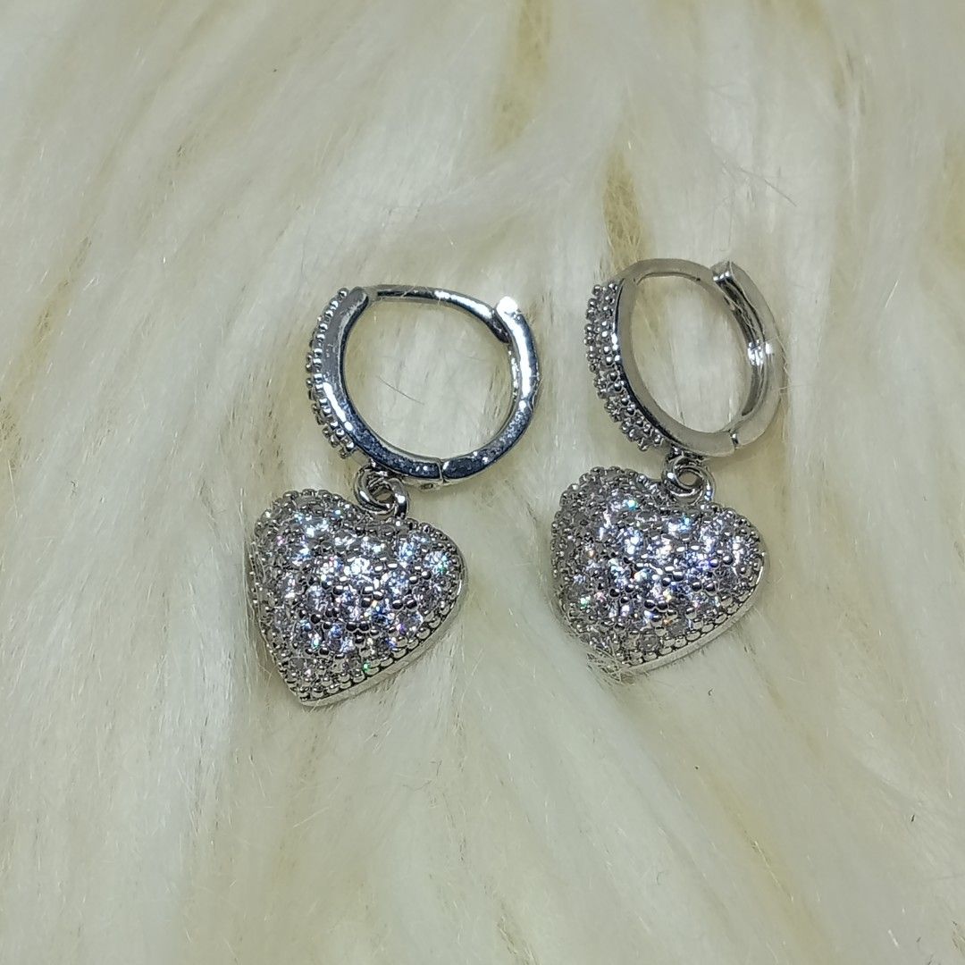 Moissanite Heart Loop Earrings ✨ 18K white goldplated (Category: Earrings) located in Ozamiz City. Submitted by leovelle. (Listing ID 1461043496, Image 1). Description: Moissanite Heart Loop Earrings ✨ 18K white goldplated.