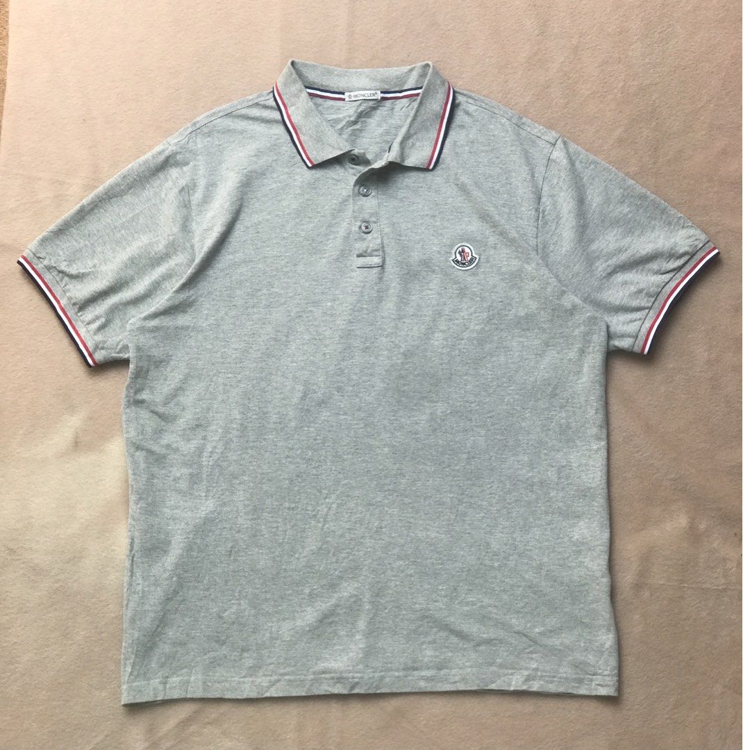 Moncler grey polo shirt (Category: Tshirts & Polo Shirts ) located in Alicia. Submitted by aljaber43 (Listing ID 1460941833, Image 1). Description: Excellent condition Color rate (9.5/10) No issue .
