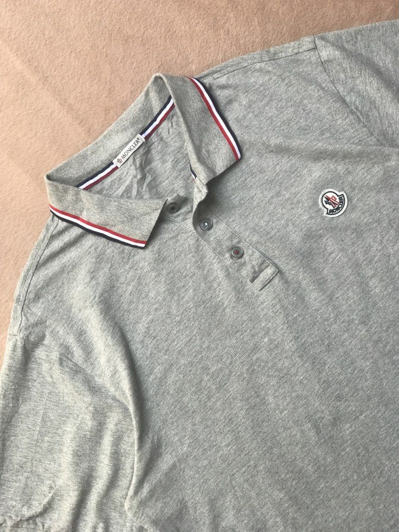 Moncler grey polo shirt (Category: Tshirts & Polo Shirts ) located in Alicia. Submitted by aljaber43 (Listing ID 1460941833, Image 3). Description: Excellent condition Color rate (9.5/10) No issue .