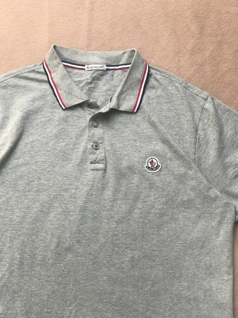 Moncler grey polo shirt (Category: Tshirts & Polo Shirts ) located in Alicia. Submitted by aljaber43 (Listing ID 1460941833, Image 2). Description: Excellent condition Color rate (9.5/10) No issue .