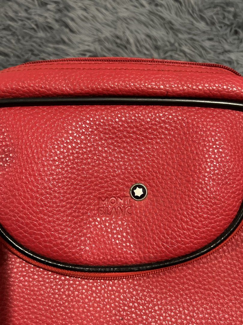 Montblanc Red Leather Travel Bag (Category: Luxury Bags & Wallets) located in Cainta. Submitted by xkengkaix (Listing ID 1461083133, Image 3). Description: - Genuine Montblanc red leather travel bag - Main zippered compartment for secure storage - Additional front zippered pocket for quick access - Adjustable strap for comfortable carrying - Interior is clean and well-maintained - Ideal for weekend getaways or as a stylish everyday bag.