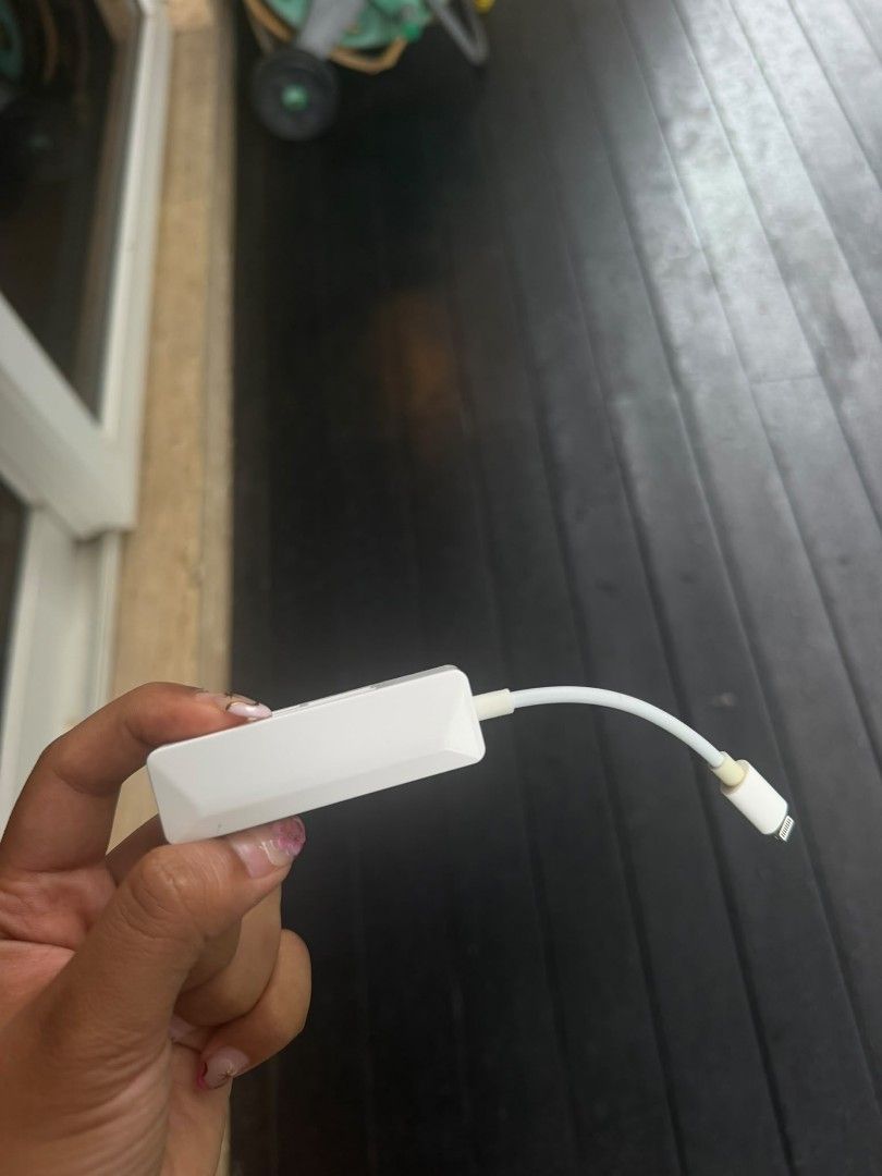 Multi-Card Reader (Category: Cables & Adaptors) located in Singapore. Submitted by nannnng (Listing ID 1460977374, Image 2). Description: - White multi-card reader - Reads SD, TF, and XD cards - Lightning connector for Apple devices (iPhone, iPad) - Compact and portable design - Ideal for on-the-go photo and file transfers.