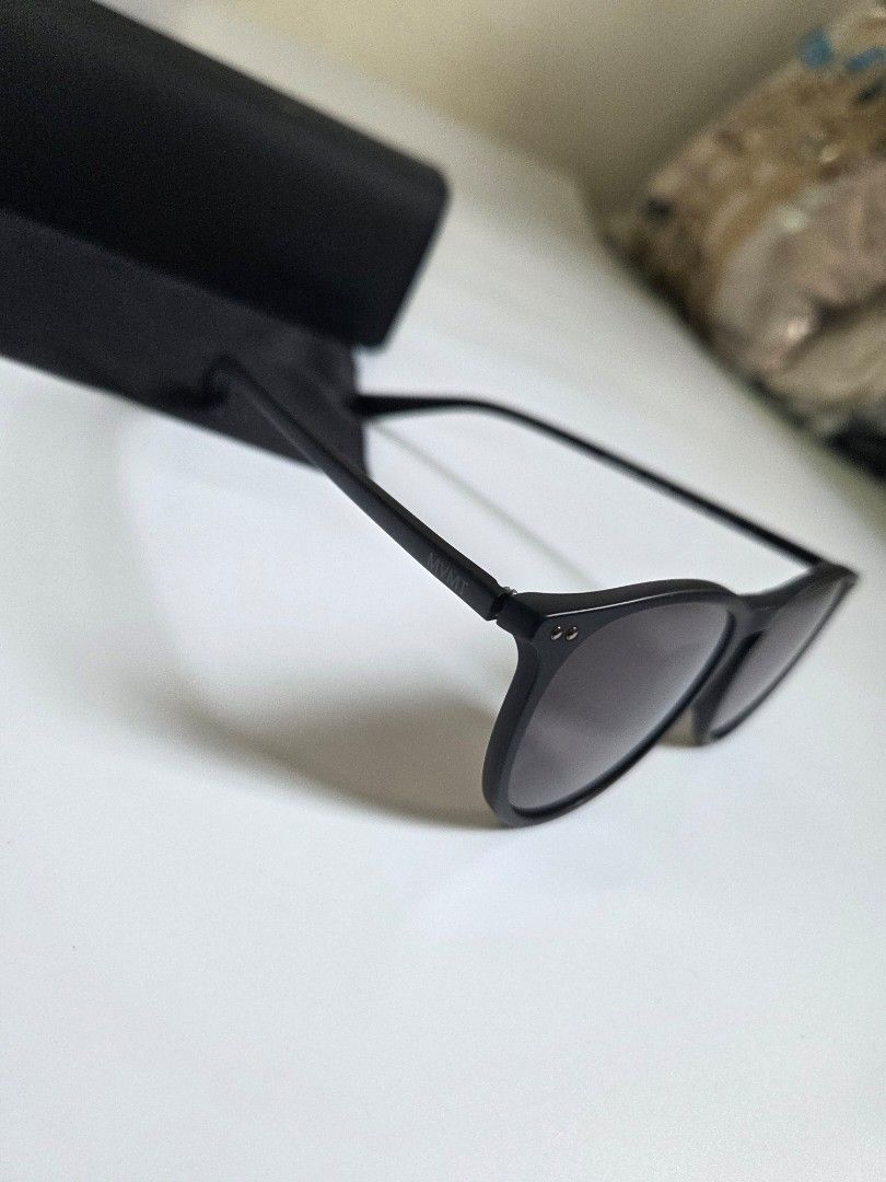 MVMT Ingram Matte Black Sunglasses - Complete Set (Near Mint) (Category: Sunglasses & Eyewear) located in Bacolod City. Submitted by maraline (Listing ID 1461019966, Image 2). Description: Selling a premium, pre-loved pair of MVMT Ingram round sunglasses in 9.5/10 crisp, near-mint condition. Features a versatile matte black frame and a classic keyhole bridge that fits comfortably on any face shape. Product Details: • Brand: MVMT • Model: Ingram (