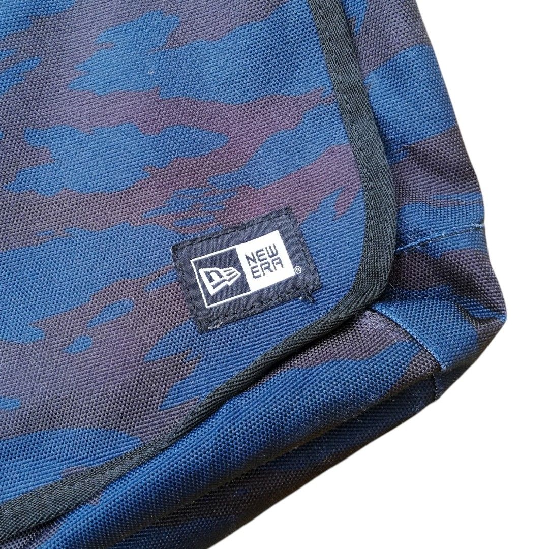 New Era Camo Messenger Bag (Category: Sling Bags) located in Cadiz. Submitted by hunteer (Listing ID 1460970733, Image 2). Description: For Sale! ‎ ‎ ‎ ‎New Era Camouflage Shoulder Bag Black/Blue ‎ ‎ ‎ ‎• In Excellent Condition, 9 out of 10 color rate ‎ ‎•100% Polyester ‎ ‎• Legit, check wash tag for authenticity ‎ ‎• Color: Camouflage ‎ ‎• Dimes: Direct Chat ‎ ‎• Issue: Sign of Usage ‎ ‎• Ready for shipping, fix price ‎ ‎• See photos (lighting m