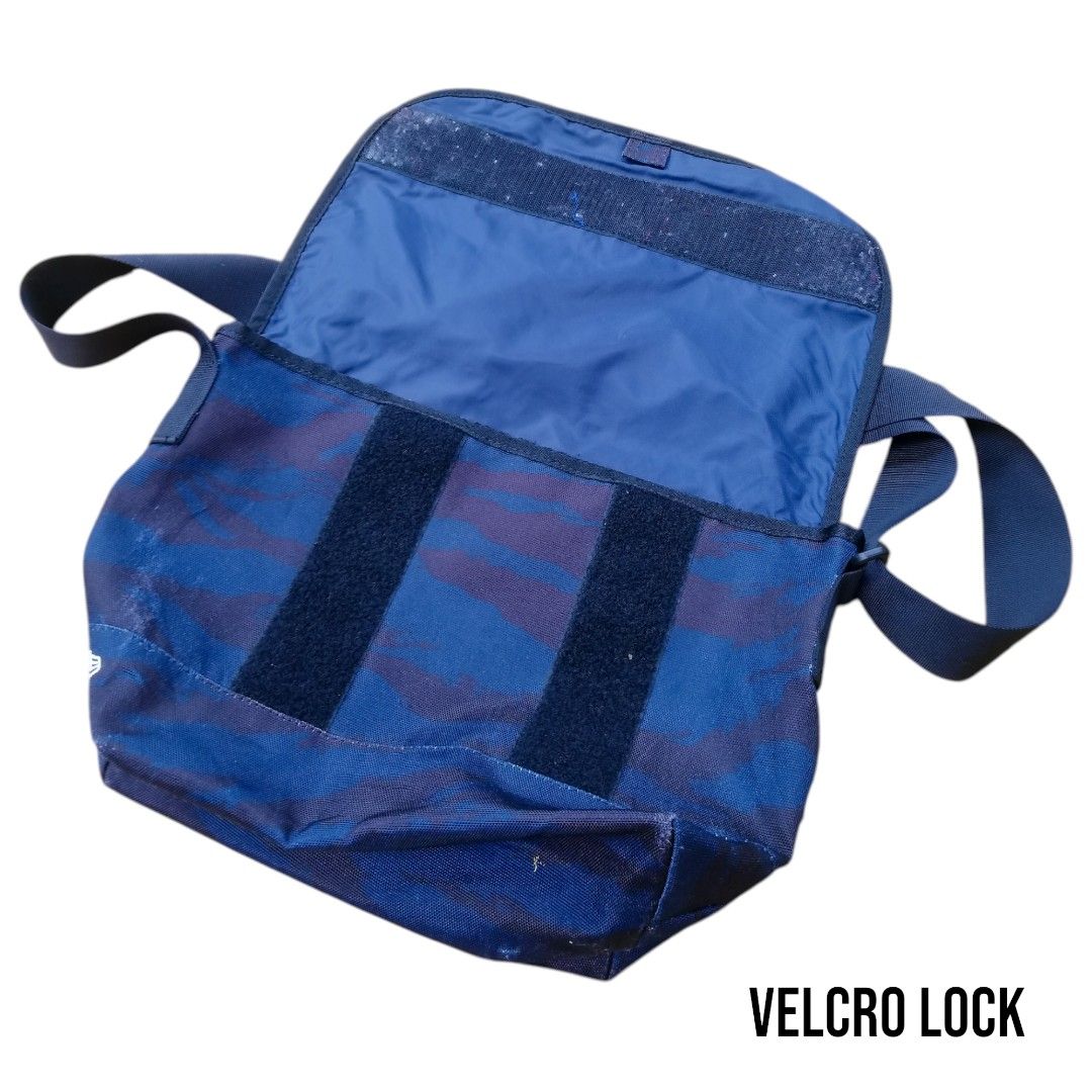 New Era Camo Messenger Bag (Category: Sling Bags) located in Cadiz. Submitted by hunteer (Listing ID 1460970733, Image 3). Description: For Sale! ‎ ‎ ‎ ‎New Era Camouflage Shoulder Bag Black/Blue ‎ ‎ ‎ ‎• In Excellent Condition, 9 out of 10 color rate ‎ ‎•100% Polyester ‎ ‎• Legit, check wash tag for authenticity ‎ ‎• Color: Camouflage ‎ ‎• Dimes: Direct Chat ‎ ‎• Issue: Sign of Usage ‎ ‎• Ready for shipping, fix price ‎ ‎• See photos (lighting m