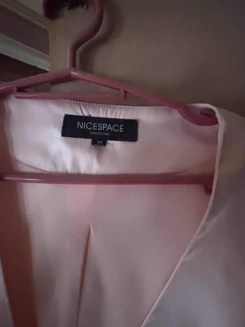 NICESPACE Collection Pink Blazer with Tie Back (Category: Coats, Jackets and Outerwear) located in Quezon City. Submitted by santimartelino (Listing ID 1461001962, Image 2). Description: - Pink cropped blazer from NICESPACE Collection - Short puff sleeves - Single button closure - Tie details at the back - Satin-like material - FITS XS-S - Ideal for dressing up outfits.