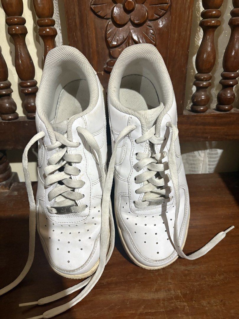 Nike Air Force 1 White Sneakers (Category: Sneakers) located in Nampicuan. Submitted by samanthani69647 (Listing ID 1461017318, Image 2). Description: - Classic white Nike Air Force 1s - Low-top design - Laces included - Shows some signs of wear on soles and uppers - Perfect for everyday casual outfits.