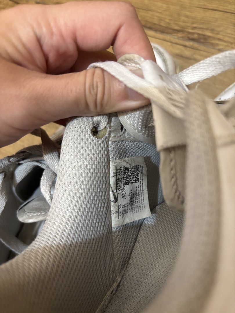 Nike Air Force 1 White Sneakers (Category: Sneakers) located in Amadeo. Submitted by ughkilaa (Listing ID 1461064897, Image 3). Description: - Classic white Nike Air Force 1s - Size: 8 US Men's / 9.5 US Women's 25cm - Signs of wear present, particularly on soles and toe box - Plenty of life remaining, perfect for everyday wear.