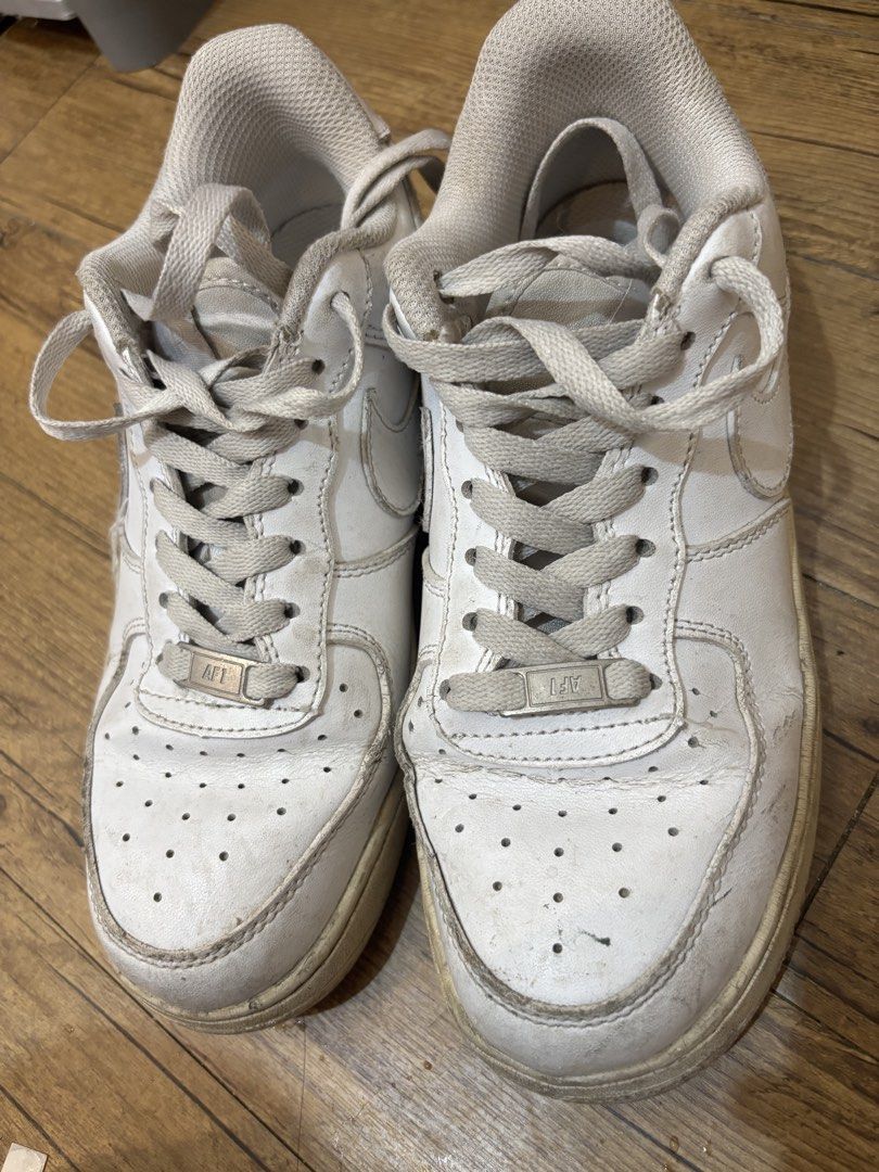 Nike Air Force 1 White Sneakers (Category: Sneakers) located in Amadeo. Submitted by ughkilaa (Listing ID 1461064897, Image 2). Description: - Classic white Nike Air Force 1s - Size: 8 US Men's / 9.5 US Women's 25cm - Signs of wear present, particularly on soles and toe box - Plenty of life remaining, perfect for everyday wear.