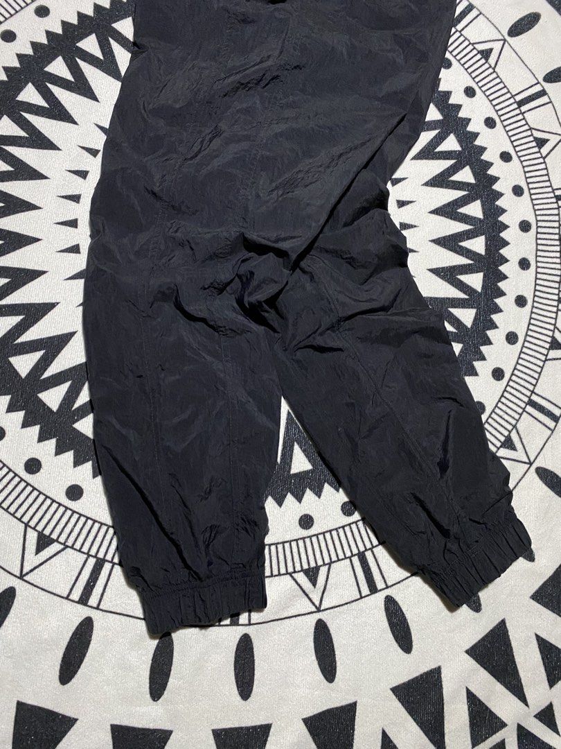 Nike Black Track Pants Joggers (Category: Joggers) located in Badiangan. Submitted by iralorana.thrift (Listing ID 1461068885, Image 2). Description: - Black Nike track pants - Elastic waistband with drawstring - Cuffed ankles - Lightweight material - Ideal for sports or casual wear - Easy to pack and move in.