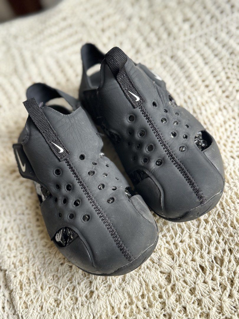 Nike Black Water Sandals (Category: Babies & Kids Fashion) located in Bacolod City. Submitted by vintage_vogue6100 (Listing ID 1461038834, Image 1). Description: - 22.5 to 23 cm - Black Nike water sandals - Ideal for beach or pool days - Easy slip-on and off design - Features drainage holes - Great for active kids - Minor scuffs from normal wear.