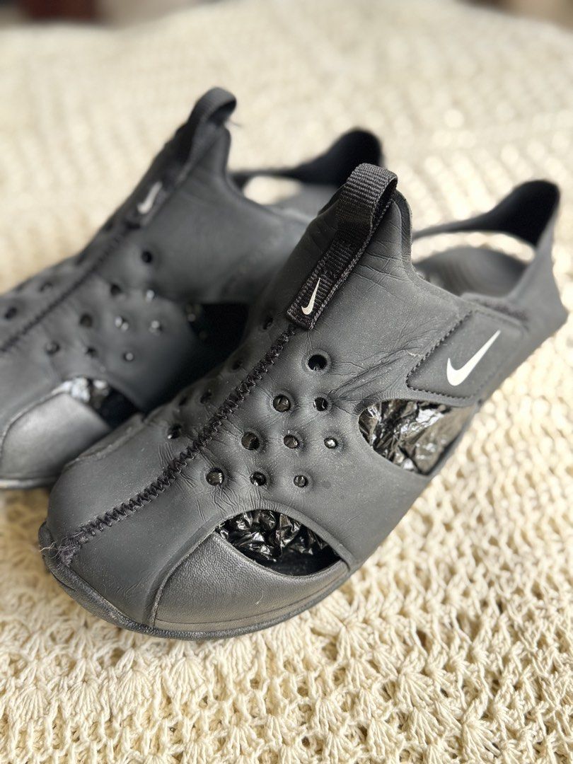 Nike Black Water Sandals (Category: Babies & Kids Fashion) located in Bacolod City. Submitted by vintage_vogue6100 (Listing ID 1461038834, Image 3). Description: - 22.5 to 23 cm - Black Nike water sandals - Ideal for beach or pool days - Easy slip-on and off design - Features drainage holes - Great for active kids - Minor scuffs from normal wear.