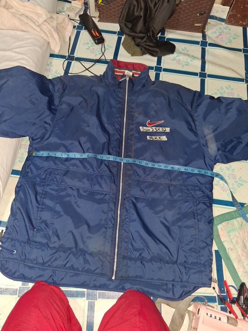 Nike Blue Windbreaker Jacket (Category: Coats, Jackets and Outerwear) located in Manila. Submitted by marcas022798212 (Listing ID 1460992904, Image 3). Description: - Blue Nike Jacket - Size: Large - Large red Nike swoosh on the back - Zipper closure with branded pull tab - Drawstring at the hem - Ideal for everyday wear.