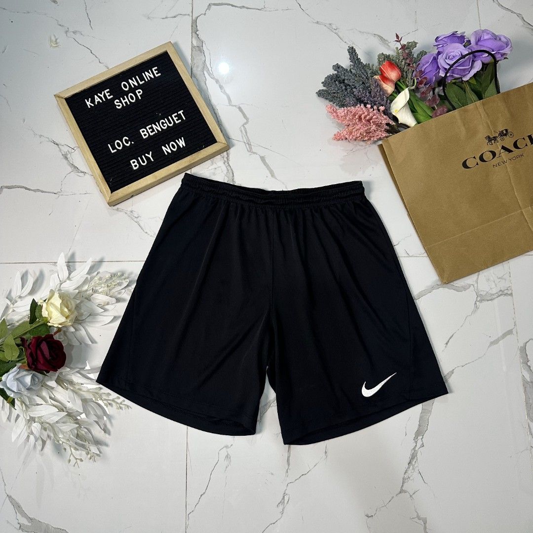 Nike dri-fit shorts (Category: Shorts) located in Baguio. Submitted by kayeonlineshop (Listing ID 1461022192, Image 3). Description: black Nike Dri-FIT training shorts featuring an elastic waistband and a white Swoosh logo on the lower left leg.
