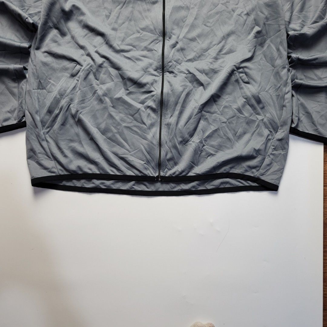 Nike Grey Full Zip Track Jacket (Category: Coats, Jackets and Outerwear) located in Cebu City. Submitted by plain.gallery (Listing ID 1460967732, Image 2). Description: Dri-Fit Grey Zipper Jacket Size: XLarge - XXLarge 👇Dimention (in inches)👇 Width: 27 Length: 31 Color rate: 9.8 Condition: 9.8 Issues: none.