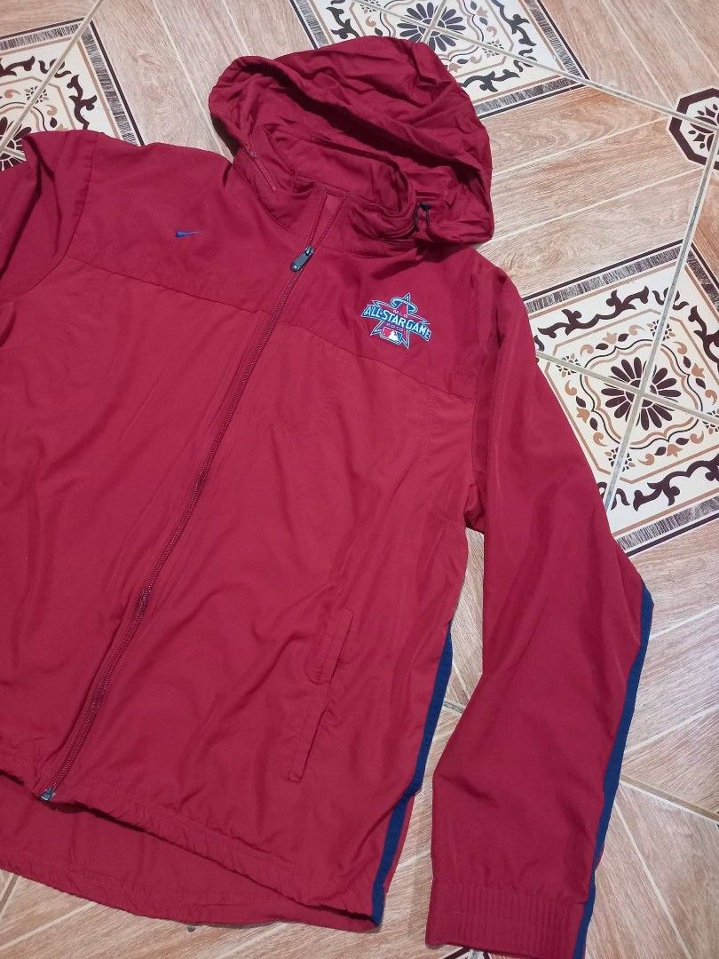 Nike MLB All-Star Game 2010 Red Hooded Jacket (Category: Coats, Jackets and Outerwear) located in Baguio. Submitted by jiannisthriftfits (Listing ID 1460971742, Image 3). Description: - Authentic Red Nike Jacket for the 2010 MLB All-Star Game - Features a convenient hood and full zip closure - Official MLB All-Star Game logo embroidered on the chest - Nike swoosh also embroidered for brand authenticity - Includes practical side pockets for storag