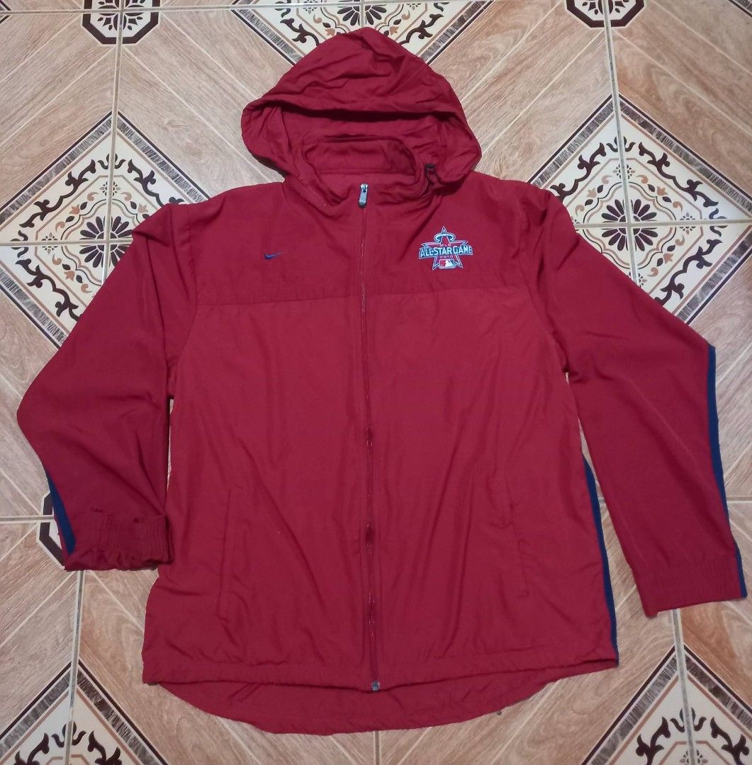 Nike MLB All-Star Game 2010 Red Hooded Jacket (Category: Coats, Jackets and Outerwear) located in Baguio. Submitted by jiannisthriftfits (Listing ID 1460971742, Image 2). Description: - Authentic Red Nike Jacket for the 2010 MLB All-Star Game - Features a convenient hood and full zip closure - Official MLB All-Star Game logo embroidered on the chest - Nike swoosh also embroidered for brand authenticity - Includes practical side pockets for storag