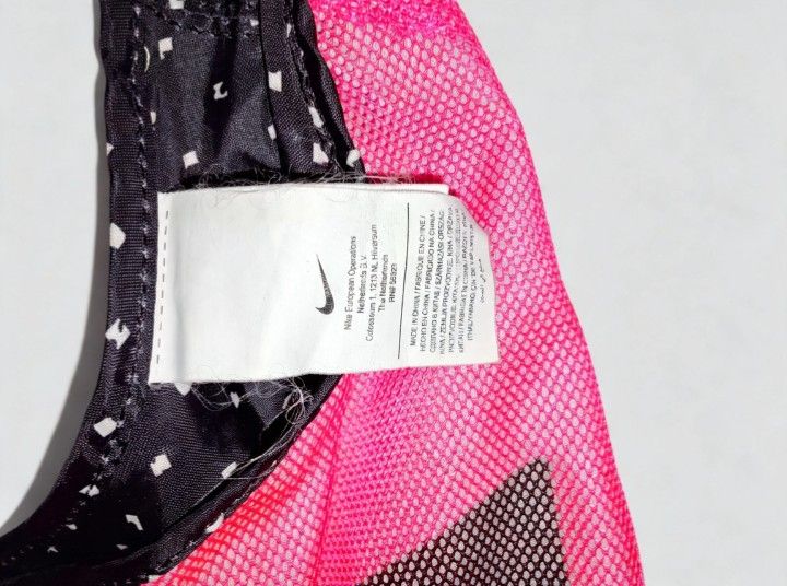 Nike Pink Mesh Tote Bag (Category: Tote Bags) located in Quezon City. Submitted by store.collections (Listing ID 1461085659, Image 2). Description: - Bright pink Nike tote bag - Lightweight mesh material - Black and white polka dot lining - Large Nike logo on the front - Ideal for gym sessions or everyday errands - Easy to carry and versatile.