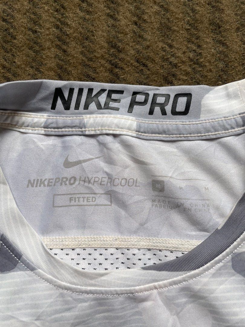 Nike Pro Hypercool Camo T-shirt (Category: Tshirts & Polo Shirts ) located in Siniloan. Submitted by rethr1ft (Listing ID 1461024403, Image 3). Description: - 23x16 dimes - Nike Pro Hypercool T-Shirt - White and Grey Camo Print - Short Sleeves, Crew Neck - Breathable Fabric for Workouts - Size: Medium (M) - Perfect for Training or Casual Wear.