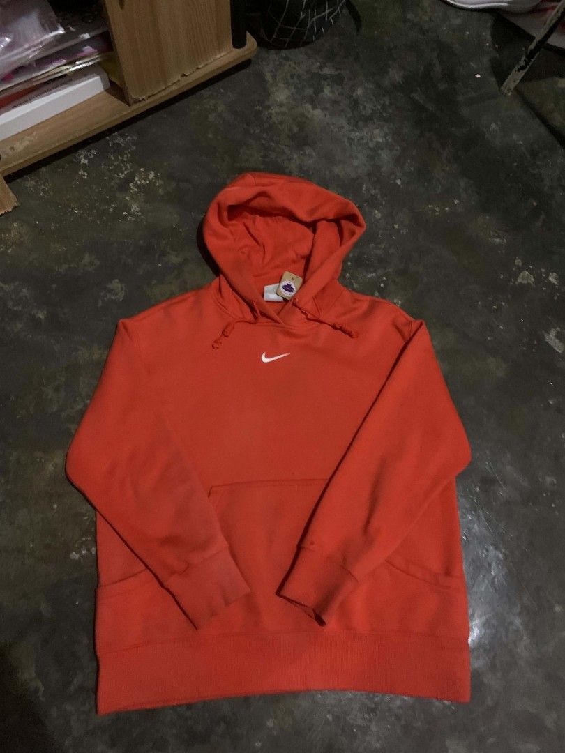 Nike Red Hoodie (Category: Hoodies) located in Caloocan City. Submitted by emmanshop (Listing ID 1461050488, Image 2). Description: - Classic red Nike hoodie - Iconic small swoosh logo on chest - Front pocket - Hooded design - Comfortable and stylish for casual wear.