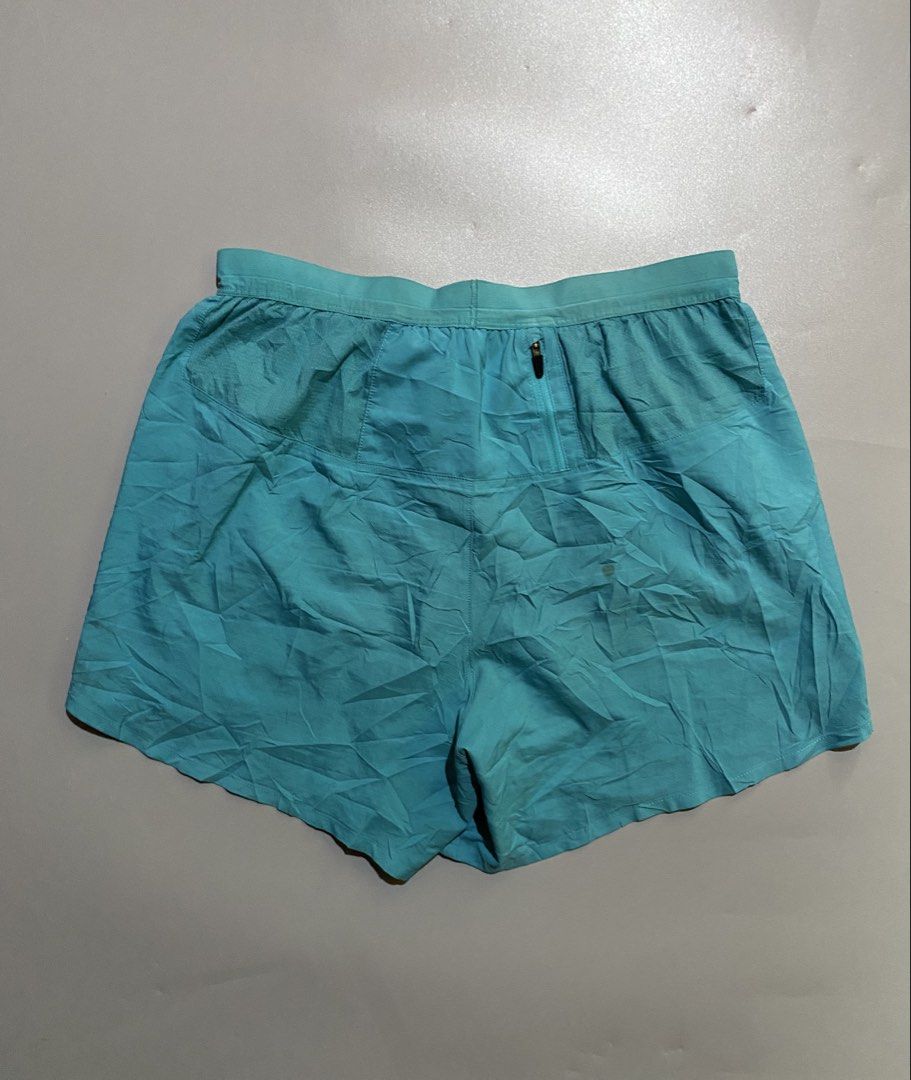 Nike Teal Running Shorts with Zip Pocket (Category: Activewear) located in Manila. Submitted by delunakenn94368 (Listing ID 1460925248, Image 2). Description: - Teal Nike running shorts - Elastic waistband with drawstring - Small zip pocket on the back - Nike logo on the leg - Lightweight material - Ideal for workouts or casual wear.