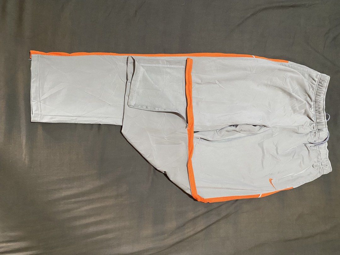 Nike techwear pants (Category: Joggers) located in Manila. Submitted by dgeneriks05 (Listing ID 1460940237, Image 2). Description: Nike techwear pants khaki and orange colorway size 4XL on tag authentic and baggy.