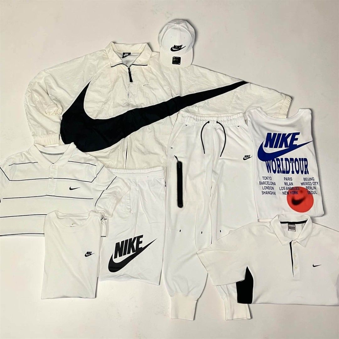 Nike White & Black Apparel Bundle - Jacket, Shorts, Tops, Cap (Category: Activewear) located in Manila. Submitted by zealpenguin.585042 (Listing ID 1461082395, Image 1). Description: - White Nike windbreaker jacket with large black swoosh - White Nike shorts - White Nike tank top with 'Worldtour' graphic - White Nike cap - Assorted white Nike polo shirts and t-shirts - All items are white or black - Great collection for any Nike fan.