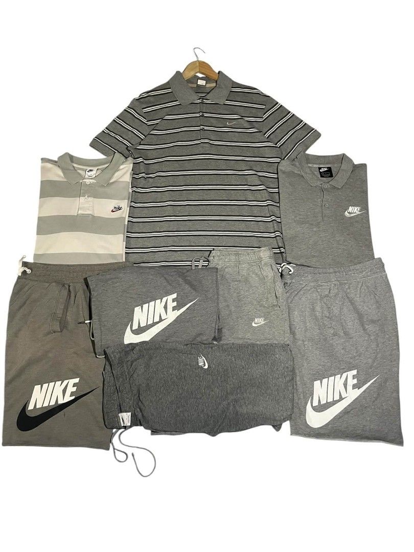 Nike White & Black Apparel Bundle - Jacket, Shorts, Tops, Cap (Category: Activewear) located in Manila. Submitted by zealpenguin.585042 (Listing ID 1461082395, Image 3). Description: - White Nike windbreaker jacket with large black swoosh - White Nike shorts - White Nike tank top with 'Worldtour' graphic - White Nike cap - Assorted white Nike polo shirts and t-shirts - All items are white or black - Great collection for any Nike fan.