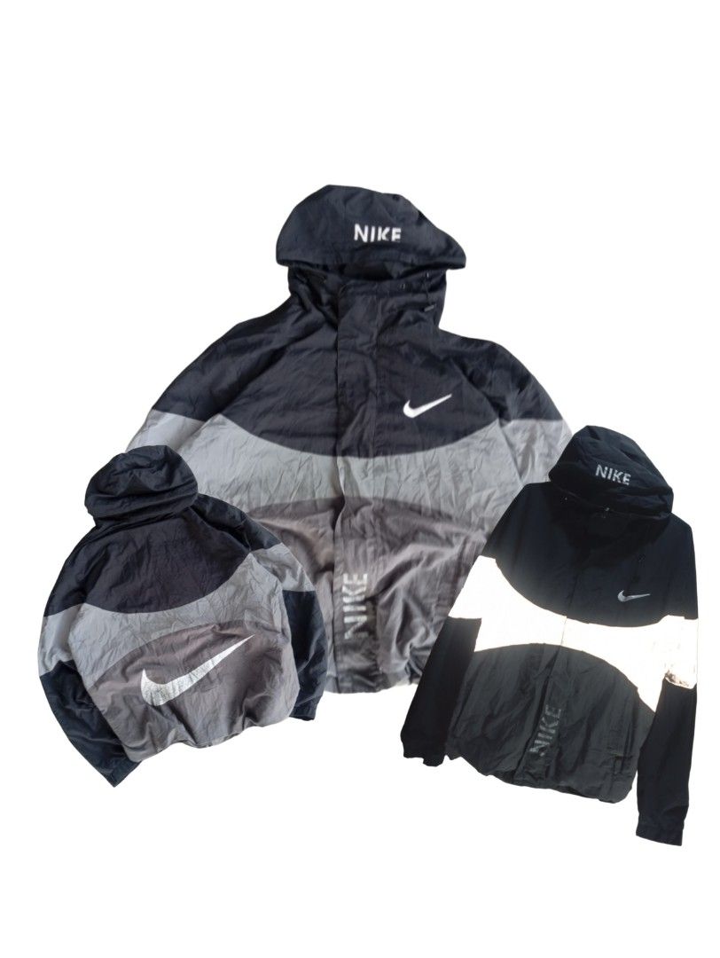 Nime reflective windbreaker (Category: Coats, Jackets and Outerwear) located in Baguio. Submitted by villa_aparel (Listing ID 1461072132, Image 1). Description: Nike reflective Length - 26.5 inches Width - 23.2 inches Issues: Fading logo, needs wash Color rate 8.9/10 Authentic/off.