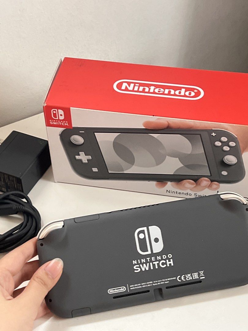 Nintendo Switch Lite - Gray (Original Box & Charger) (Category: Nintendo) located in Cavite. Submitted by prelovedclothesbyc_ (Listing ID 1460927134, Image 3). Description: - Nintendo Switch Lite (Gray) - Includes original box and charger - Ideal for gaming on the go - All buttons and controls are fully functional - Ready for a new owner.