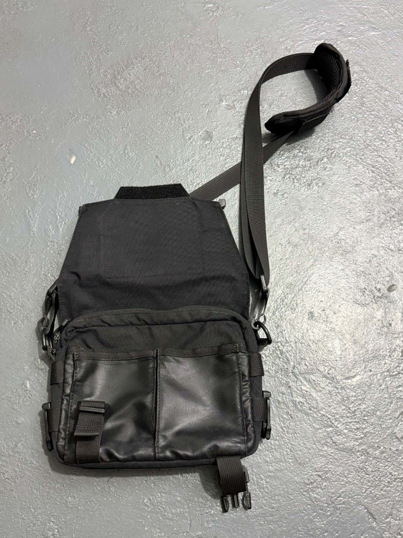 Nitecore Sling Bag (Category: Sling Bags) located in General Trias. Submitted by qwerty2015 (Listing ID 1460938118, Image 2). Description: - Durable black messenger bag - MOLLE system on front and sides for customizable attachments - Velcro panel on the flap for quick access - Adjustable strap with comfortable shoulder padding - Multiple internal compartments for excellent organization - Built with tough, long-lasting material.