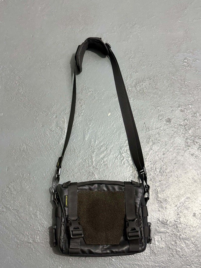 Nitecore Sling Bag (Category: Sling Bags) located in General Trias. Submitted by qwerty2015 (Listing ID 1460938118, Image 1). Description: - Durable black messenger bag - MOLLE system on front and sides for customizable attachments - Velcro panel on the flap for quick access - Adjustable strap with comfortable shoulder padding - Multiple internal compartments for excellent organization - Built with tough, long-lasting material.