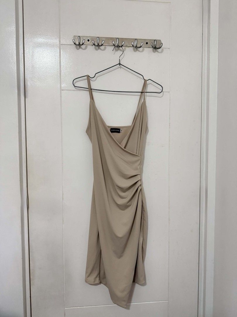 Nude Ruched Bodycon Mini Dress (Category: Dresses) located in Quezon City. Submitted by yciaa (Listing ID 1460977725, Image 1). Description: - Nude ruched bodycon mini dress - Spaghetti straps - Flattering wrap front design - Asymmetrical hemline with side ruching - Versatile for night outs or special occasions - Easy to dress up or down.