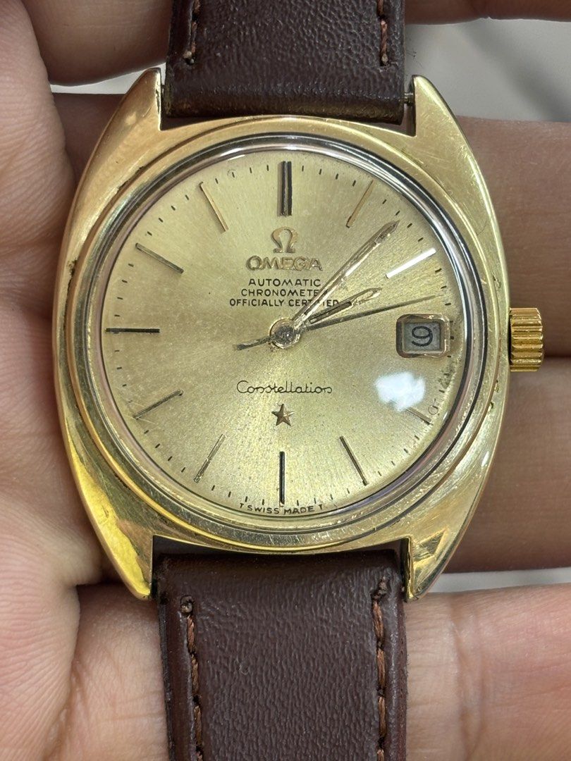 Omega Constellation Automatic Chronometer Gold Watch (Category: Luxury Watches) located in San Fernando. Submitted by kelvzwapps (Listing ID 1460956406, Image 1). Description: - Vintage Omega Constellation Watch - Gold Dial with Date Window - Brown Leather Strap with Gold Buckle - Omega Constellation Emblem on Case Back - Swiss Made - Omega Constellation -Calibre: 168.017 -Movement: 564 -Good Condition -14k Solid Gold Ring -14k Case jacketed Gold