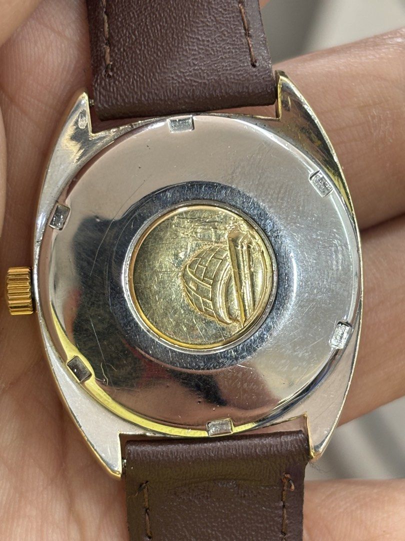 Omega Constellation Automatic Chronometer Gold Watch (Category: Luxury Watches) located in San Fernando. Submitted by kelvzwapps (Listing ID 1460956406, Image 2). Description: - Vintage Omega Constellation Watch - Gold Dial with Date Window - Brown Leather Strap with Gold Buckle - Omega Constellation Emblem on Case Back - Swiss Made - Omega Constellation -Calibre: 168.017 -Movement: 564 -Good Condition -14k Solid Gold Ring -14k Case jacketed Gold