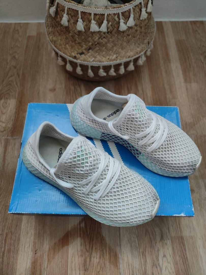 Original Adidas white mesh sneaker deerupt runner with box (Category: Sneakers) located in Cavite. Submitted by itstrish23 (Listing ID 1461053052, Image 2). Description: - Brand: Adidas - Model: Deerupt Runner - Color: White - Material: Breathable mesh upper - Design: Unique webbed sole and grid pattern - Condition: Excellent, like new - Includes: Original Adidas box - Size: EU 37 (UK 4 / US 6).
