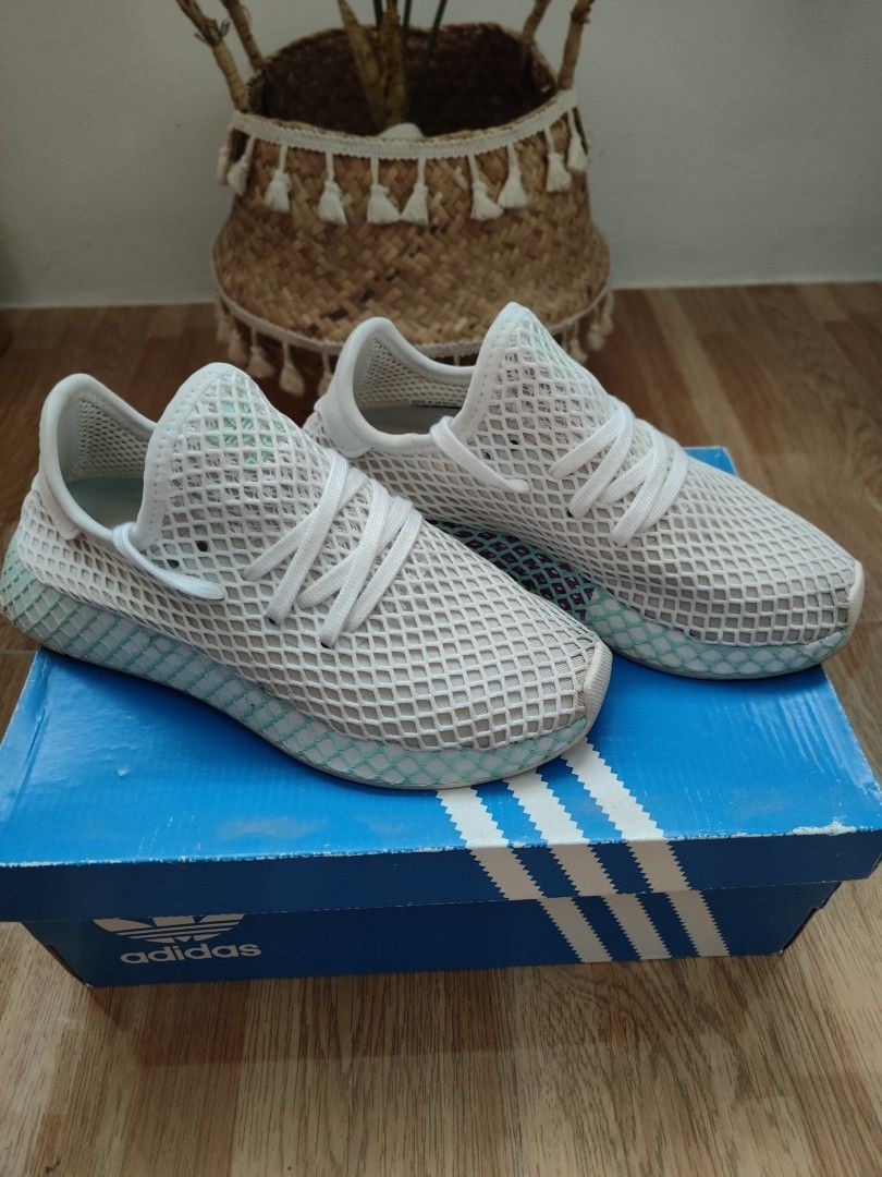Original Adidas white mesh sneaker deerupt runner with box (Category: Sneakers) located in Cavite. Submitted by itstrish23 (Listing ID 1461053052, Image 1). Description: - Brand: Adidas - Model: Deerupt Runner - Color: White - Material: Breathable mesh upper - Design: Unique webbed sole and grid pattern - Condition: Excellent, like new - Includes: Original Adidas box - Size: EU 37 (UK 4 / US 6).