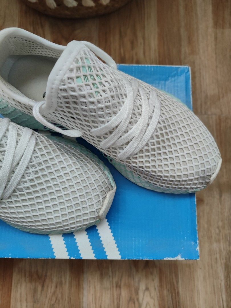 Original Adidas white mesh sneaker deerupt runner with box (Category: Sneakers) located in Cavite. Submitted by itstrish23 (Listing ID 1461053052, Image 3). Description: - Brand: Adidas - Model: Deerupt Runner - Color: White - Material: Breathable mesh upper - Design: Unique webbed sole and grid pattern - Condition: Excellent, like new - Includes: Original Adidas box - Size: EU 37 (UK 4 / US 6).