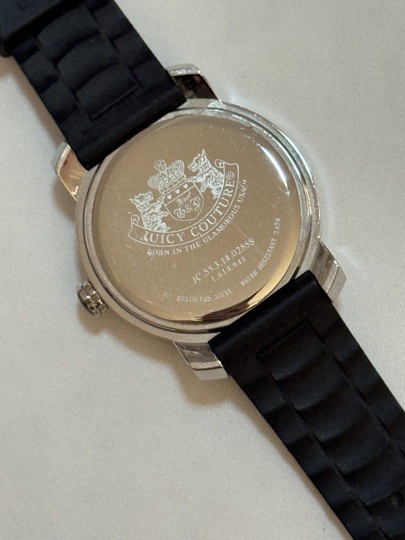 ORIGINAL Juicy Couture Watch Black Rubber Strap (Category: Women's Watches) located in Manila. Submitted by khatalogue (Listing ID 1460990190, Image 3). Description: - Authentic Juicy Couture watch - Silver dial with a striking green stone bezel - Comfortable black rubber strap with buckle closure - Durable stainless steel case - Water resistant up to 3 ATM - Features 'Born in the Glamorous USA' engraving on the back - Model number: JC 55.3.14.02
