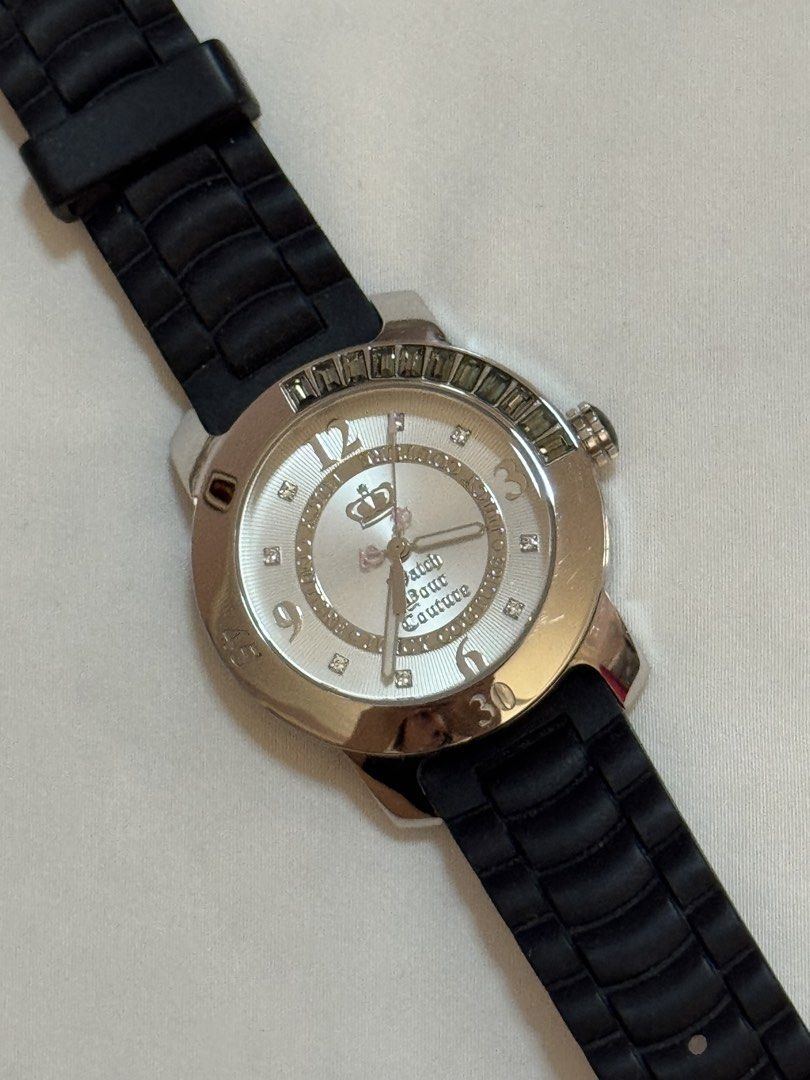 ORIGINAL Juicy Couture Watch Black Rubber Strap (Category: Women's Watches) located in Manila. Submitted by khatalogue (Listing ID 1460990190, Image 1). Description: - Authentic Juicy Couture watch - Silver dial with a striking green stone bezel - Comfortable black rubber strap with buckle closure - Durable stainless steel case - Water resistant up to 3 ATM - Features 'Born in the Glamorous USA' engraving on the back - Model number: JC 55.3.14.02