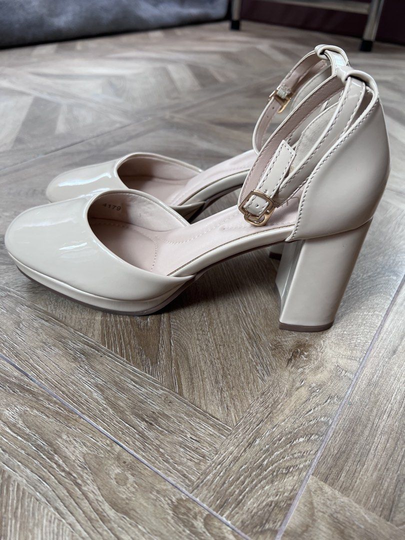 OSUKI Beige Patent Block Heels with Ankle Strap (Category: Heels) located in Quezon City. Submitted by peg905 (Listing ID 1460995750, Image 3). Description: - OSUKI Beige Patent Block Heels - Features a stylish block heel - Adjustable ankle strap for a secure fit - Glossy patent finish for added shine - Comfortable insole for all-day wear - Ideal for elevating any outfit - Brand new, never worn (impulse purchase).