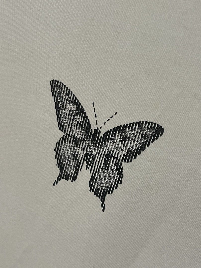 OXYGN Graphic Ringer Tee (Category: Shirts) located in Santa Cruz. Submitted by lilpurpleseven (Listing ID 1460933069, Image 2). Description: - White ringer tee by EXGN - Black collar and sleeve cuffs - Features a cool black butterfly graphic on the front - Tagged as Extra Small (XS) - Regular fit - Ideal for a casual and stylish look.