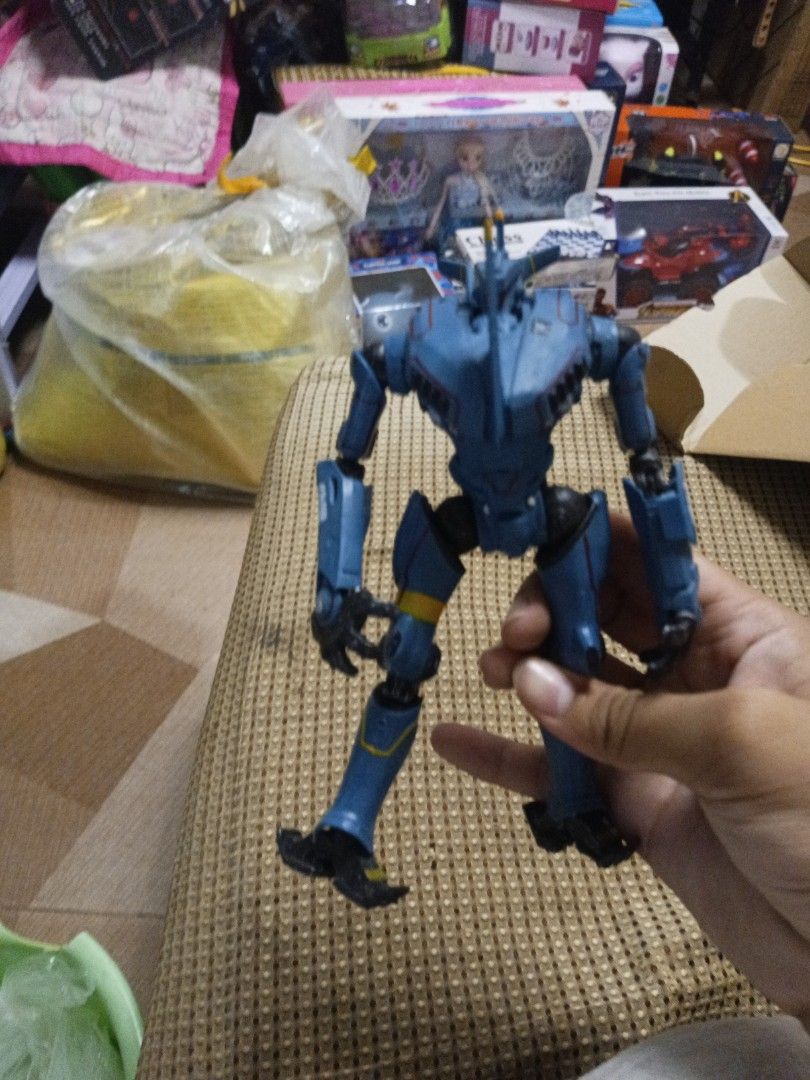 Pacific Rim Romeo Blue Action Figure (Category: Figurines & Statues) located in Tanza. Submitted by --unicorn-- (Listing ID 1461034627, Image 1). Description: - Romeo Blue action figure from Pacific Rim - Striking blue color with yellow accents - Fully articulated joints for dynamic posing - Ideal for fans of the movie - Minor scuffs present on the feet.